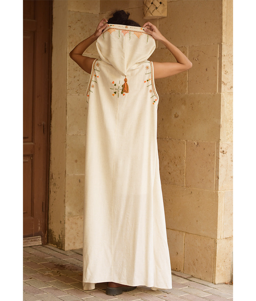 Off white Siwa Heavily Embroidered Linen Dress with Hoodie handmade in Egypt & available at Jozee Boutique.