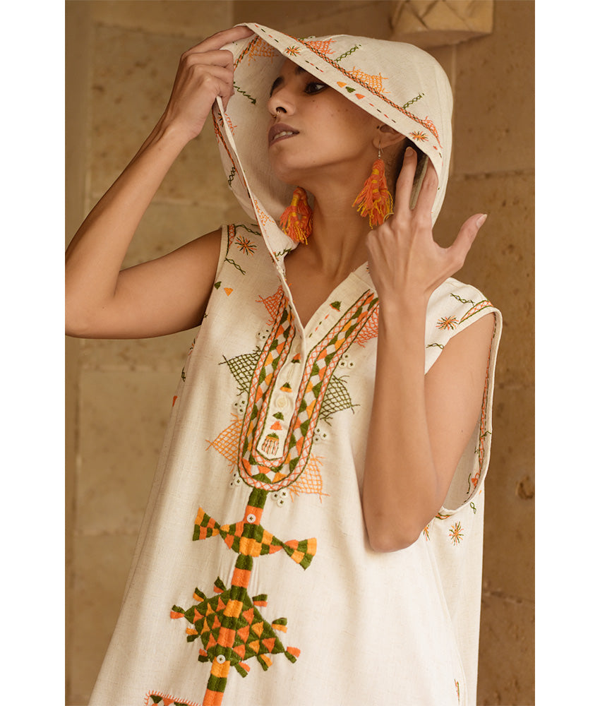 Off white Siwa Heavily Embroidered Linen Dress with Hoodie handmade in Egypt & available at Jozee Boutique.