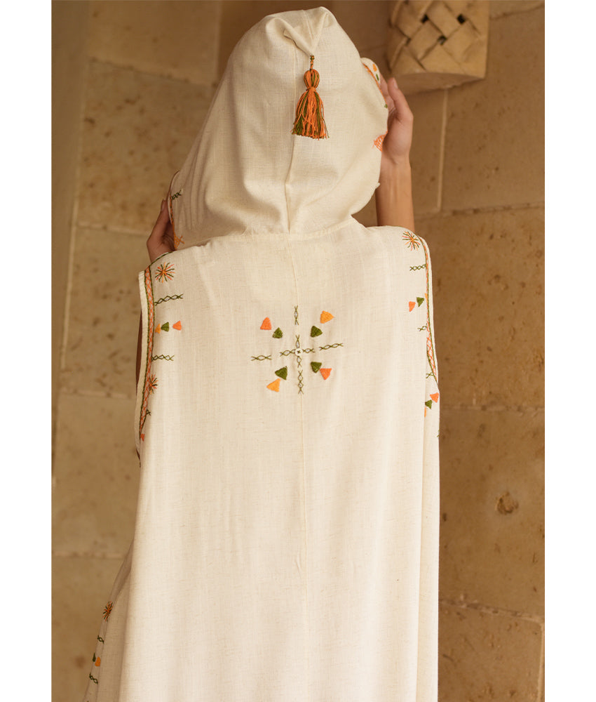 Off white Siwa Heavily Embroidered Linen Dress with Hoodie handmade in Egypt & available at Jozee Boutique.