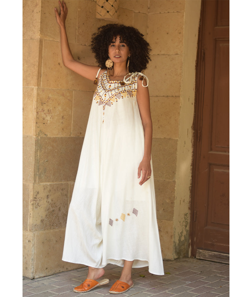 White Siwa Embroidered Linen Flowy Jumpsuit/Dress handmade in Egypt & available at Jozee Boutique.