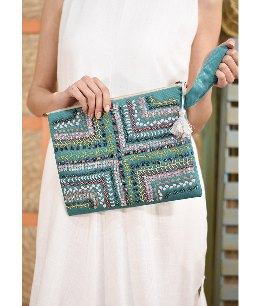Turquoise Embroidered Clutch handmade in Egypt & available at Jozee Boutique.