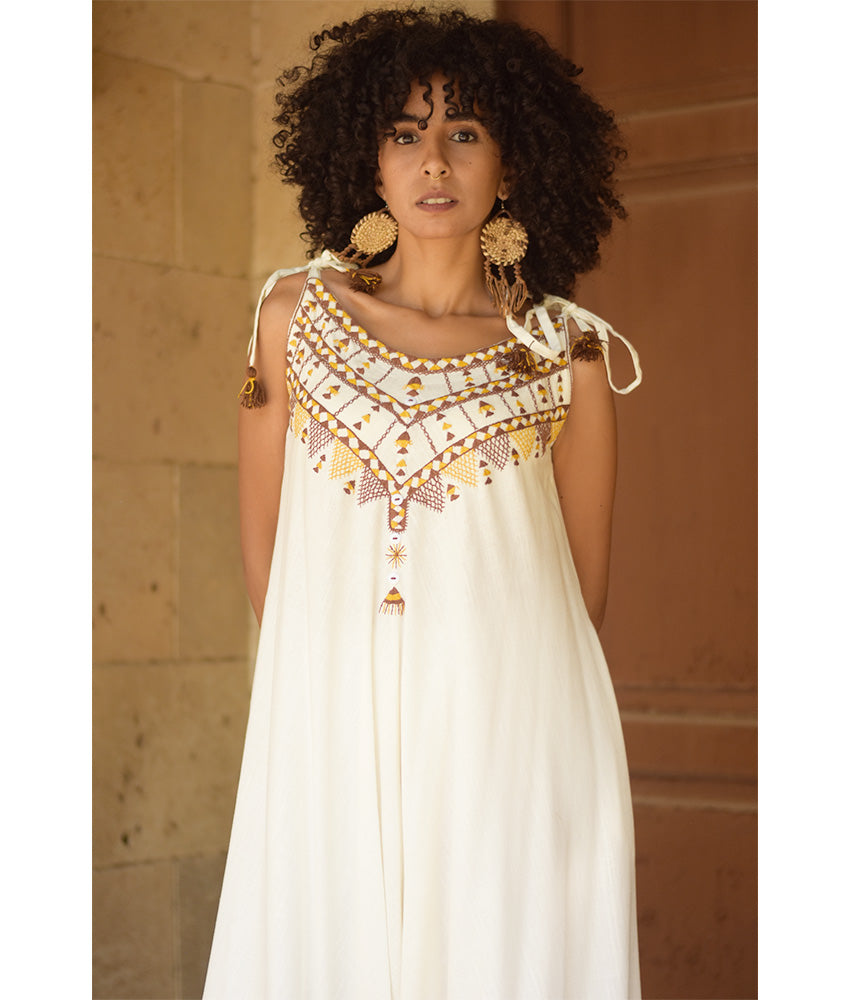 White Siwa Embroidered Linen Flowy Jumpsuit/Dress handmade in Egypt & available at Jozee Boutique.