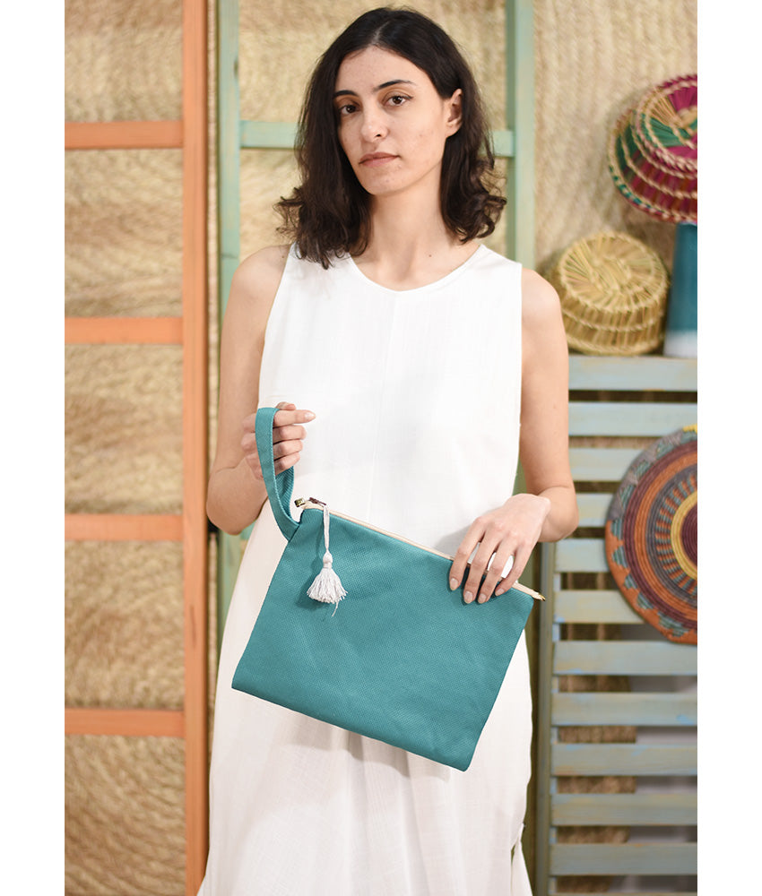 Turquoise Embroidered Clutch handmade in Egypt & available at Jozee Boutique.