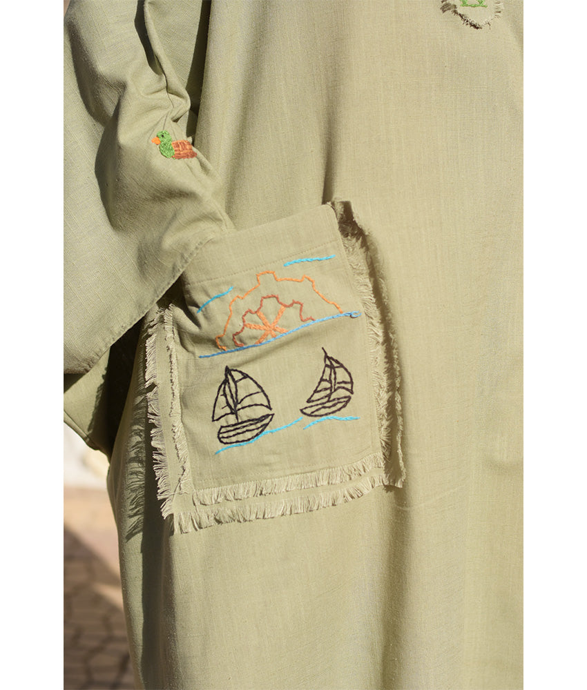 Light Olive Hand Embroidered Linen Kaftan with Hoodie handmade in Egypt & available at Jozee Boutique.