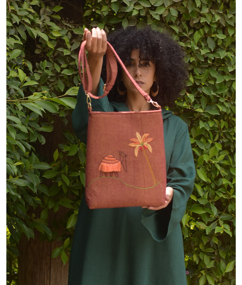 Brown Embroidered Palm Linen Cross Bag handmade in Egypt & available at Jozee Boutique.handmade in Egypt & available at Jozee Boutique.