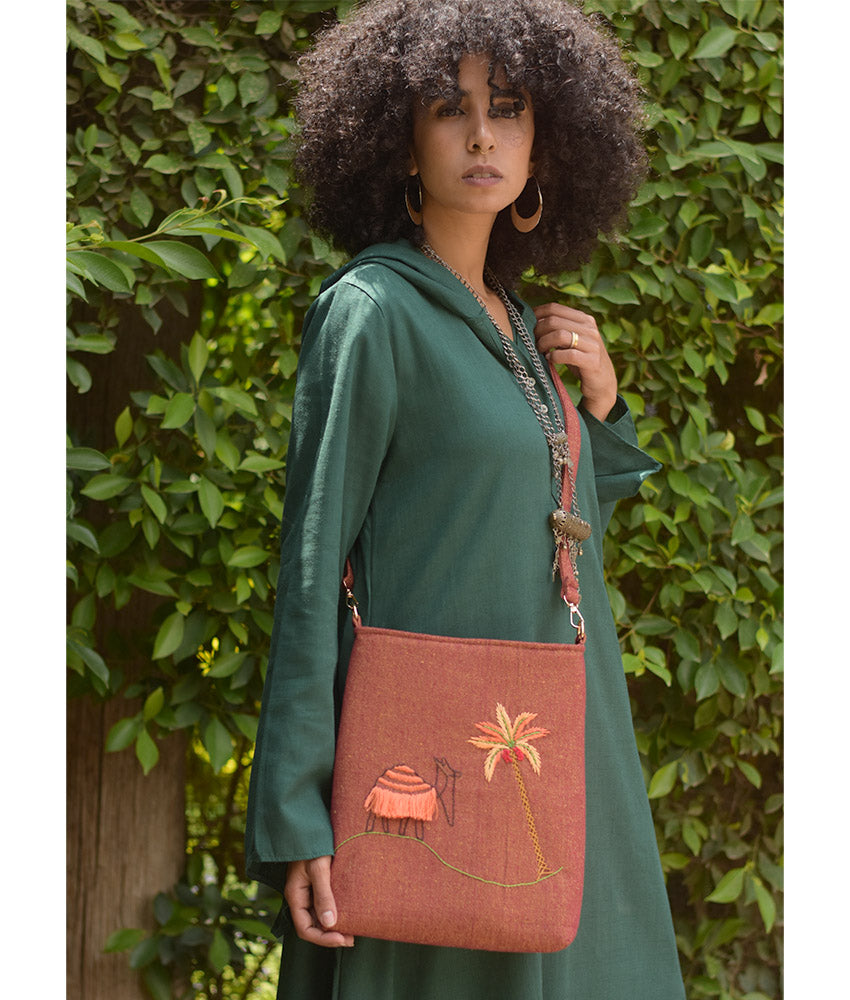 Brown Embroidered Palm Linen Cross Bag handmade in Egypt & available at Jozee Boutique.handmade in Egypt & available at Jozee Boutique.