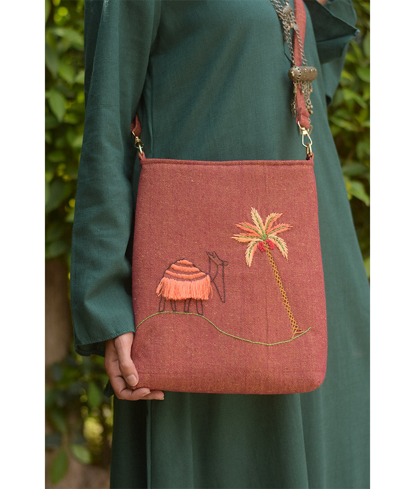 Brown Embroidered Palm Linen Cross Bag handmade in Egypt & available at Jozee Boutique.handmade in Egypt & available at Jozee Boutique.