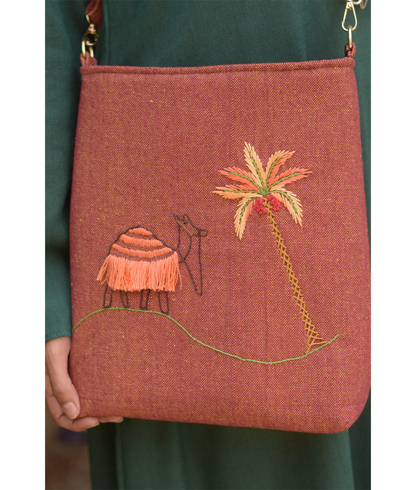 Brown Embroidered Palm Linen Cross Bag handmade in Egypt & available at Jozee Boutique.handmade in Egypt & available at Jozee Boutique.