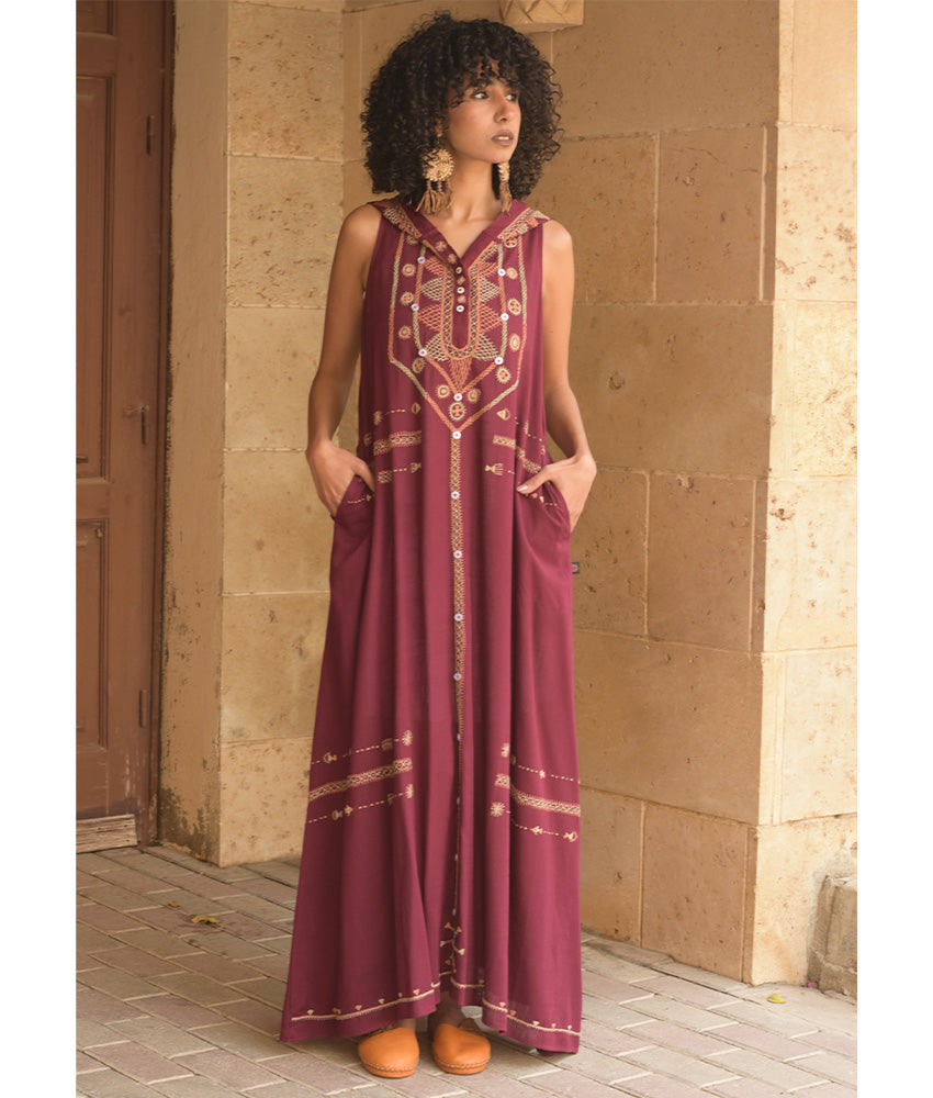 Burgundy Siwa Heavily Embroidered Linen Dress with Hoodie handmade in Egypt & available at Jozee Boutique.