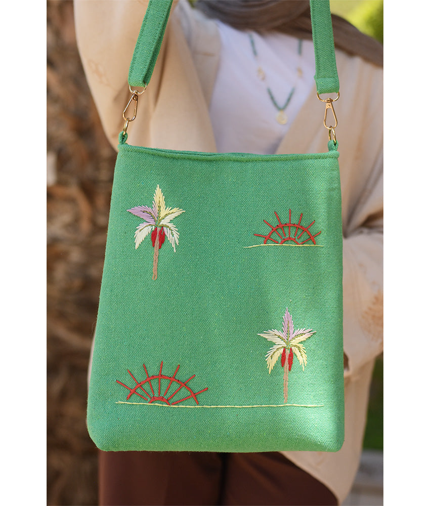 Mint green Embroidered Palm Linen Cross Bag handmade in Egypt & available at Jozee Boutique.handmade in Egypt & available at Jozee Boutique.