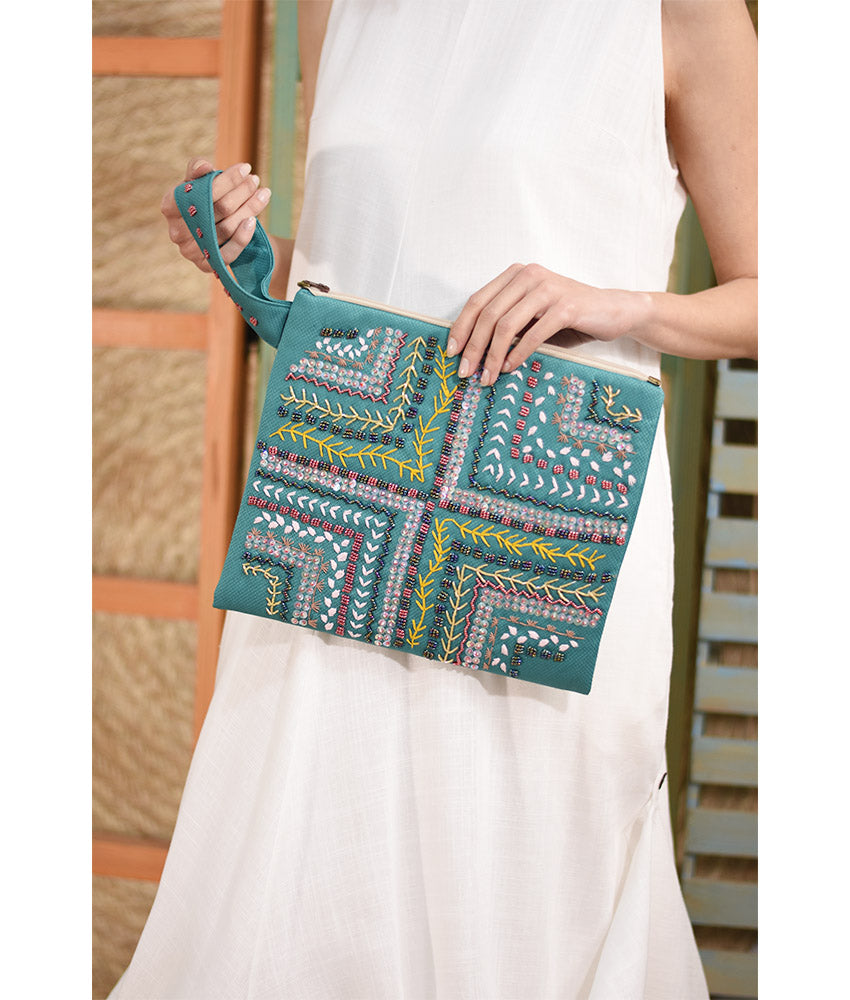 Turquoise Embroidered Clutch handmade in Egypt & available at Jozee Boutique.