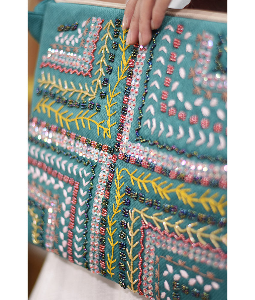 Turquoise Embroidered Clutch handmade in Egypt & available at Jozee Boutique.
