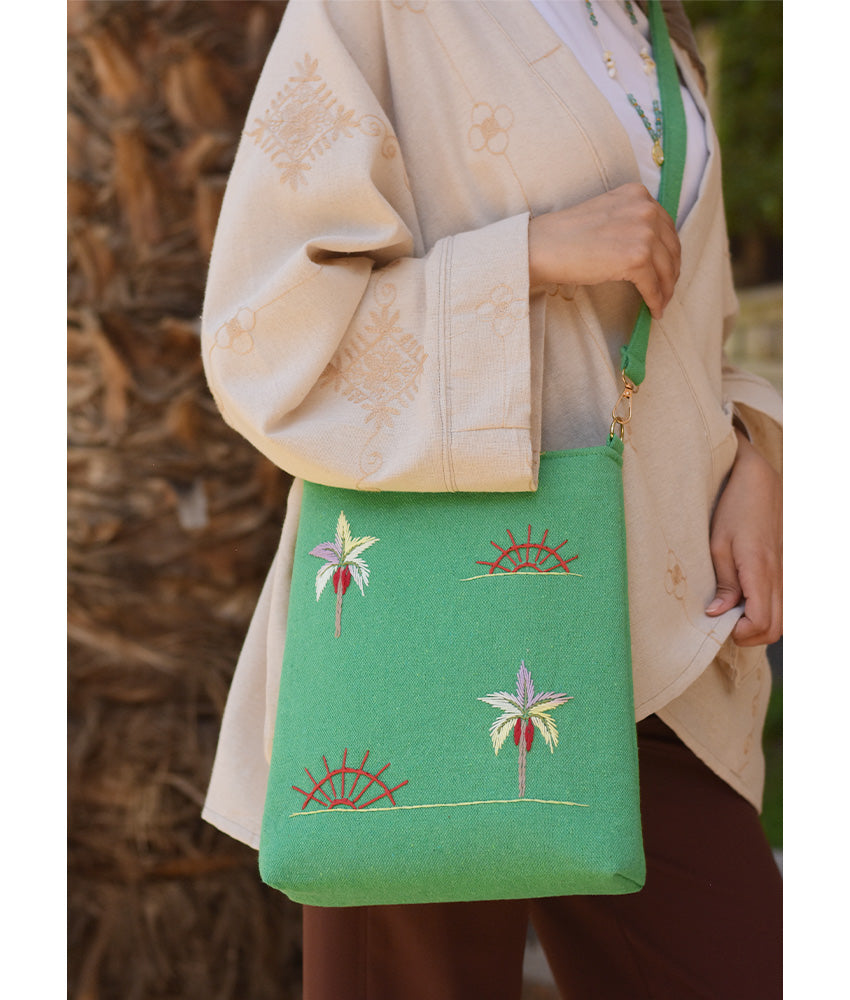 Mint green Embroidered Palm Linen Cross Bag handmade in Egypt & available at Jozee Boutique.handmade in Egypt & available at Jozee Boutique.