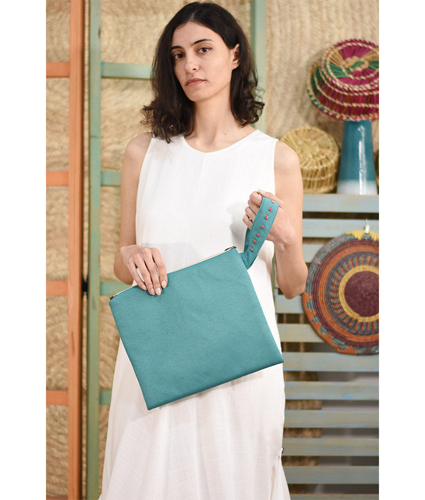 Turquoise Embroidered Clutch handmade in Egypt & available at Jozee Boutique.