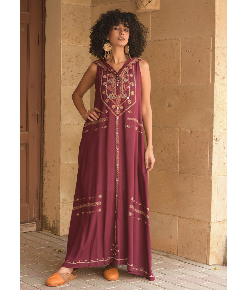 Burgundy Siwa Heavily Embroidered Linen Dress with Hoodie handmade in Egypt & available at Jozee Boutique.
