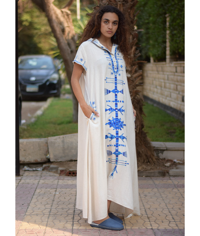 White Siwa Heavily Embroidered Linen Dress with Hoodie handmade in Egypt & available at Jozee Boutique.
