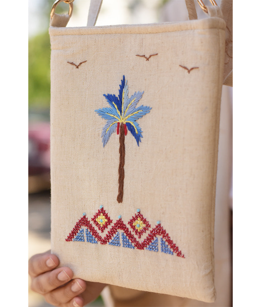Off white Embroidered Palm Linen Cross Bag handmade in Egypt & available at Jozee Boutique.handmade in Egypt & available at Jozee Boutique.