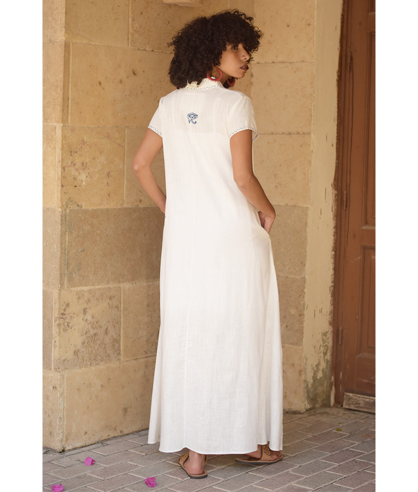Off-White Linen Dress with Ancient Egyptian Lotus Embroidery handmade in Egypt & available at Jozee Boutique.