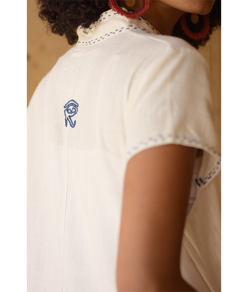 Off-White Linen Dress with Ancient Egyptian Lotus Embroidery handmade in Egypt & available at Jozee Boutique.