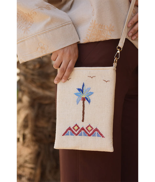 Off white Embroidered Palm Linen Cross Bag handmade in Egypt & available at Jozee Boutique.handmade in Egypt & available at Jozee Boutique.