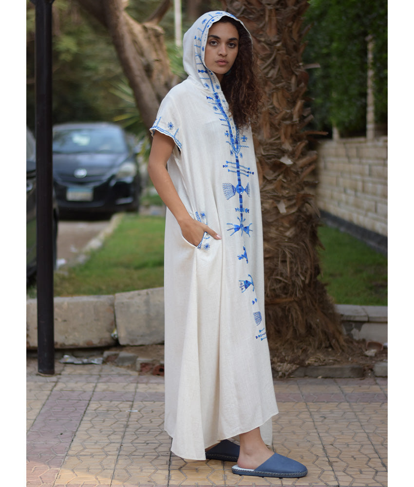 White Siwa Heavily Embroidered Linen Dress with Hoodie handmade in Egypt & available at Jozee Boutique.