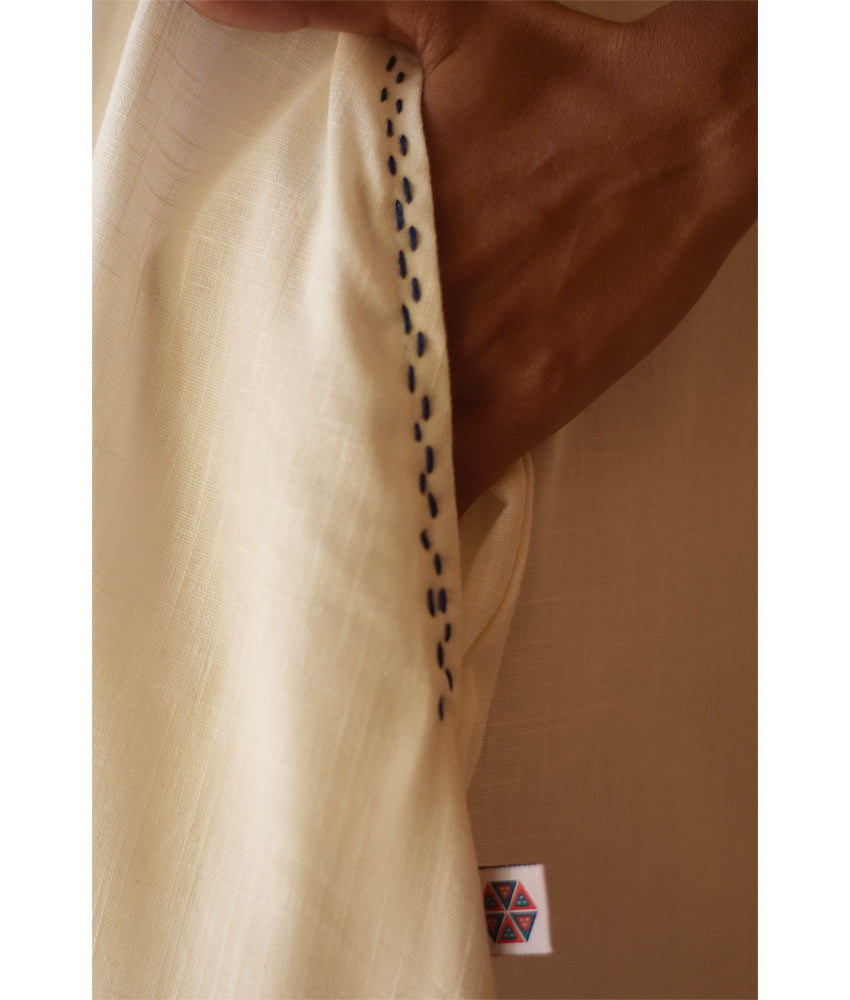 Off-White Linen Dress with Ancient Egyptian Lotus Embroidery handmade in Egypt & available at Jozee Boutique.