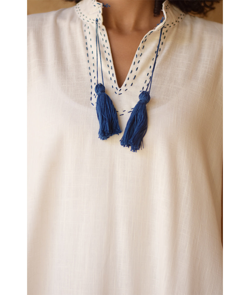 Off-White Linen Dress with Ancient Egyptian Lotus Embroidery handmade in Egypt & available at Jozee Boutique.