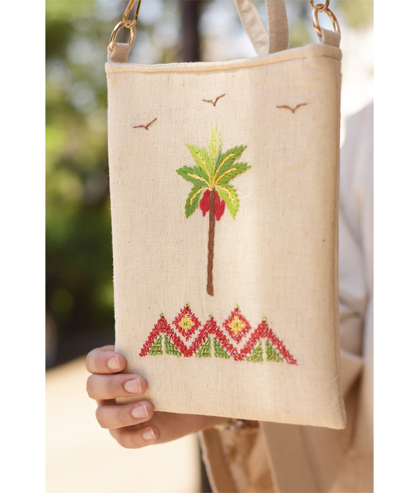 Off white Embroidered Palm Linen Cross Bag handmade in Egypt & available at Jozee Boutique.handmade in Egypt & available at Jozee Boutique.