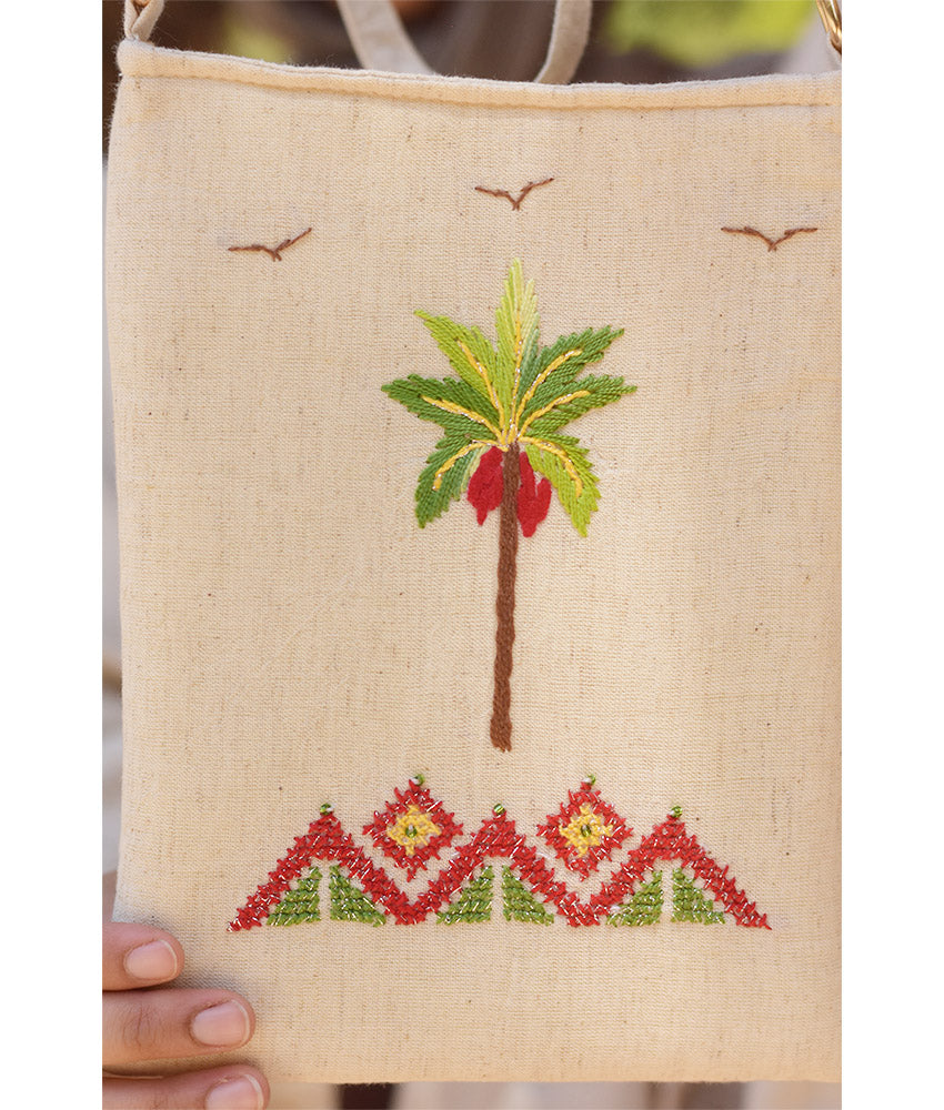 Off white Embroidered Palm Linen Cross Bag handmade in Egypt & available at Jozee Boutique.handmade in Egypt & available at Jozee Boutique.