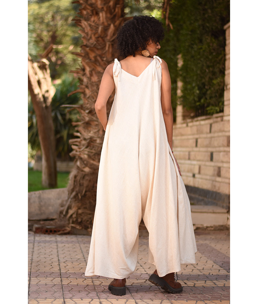 Off White Flowy Jumpsuit/Dress handmade in Egypt & available at Jozee Boutique.