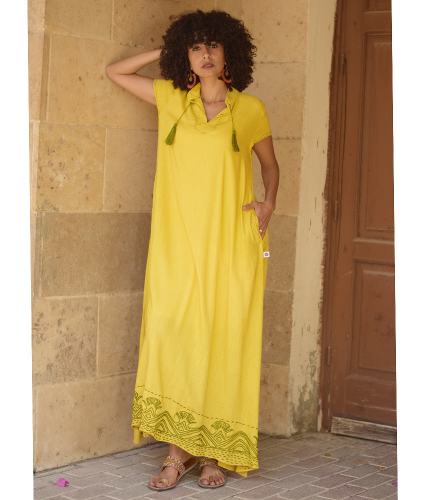 Yellow Linen Dress with Ancient Egyptian Lotus Embroidery handmade in Egypt & available at Jozee Boutique.