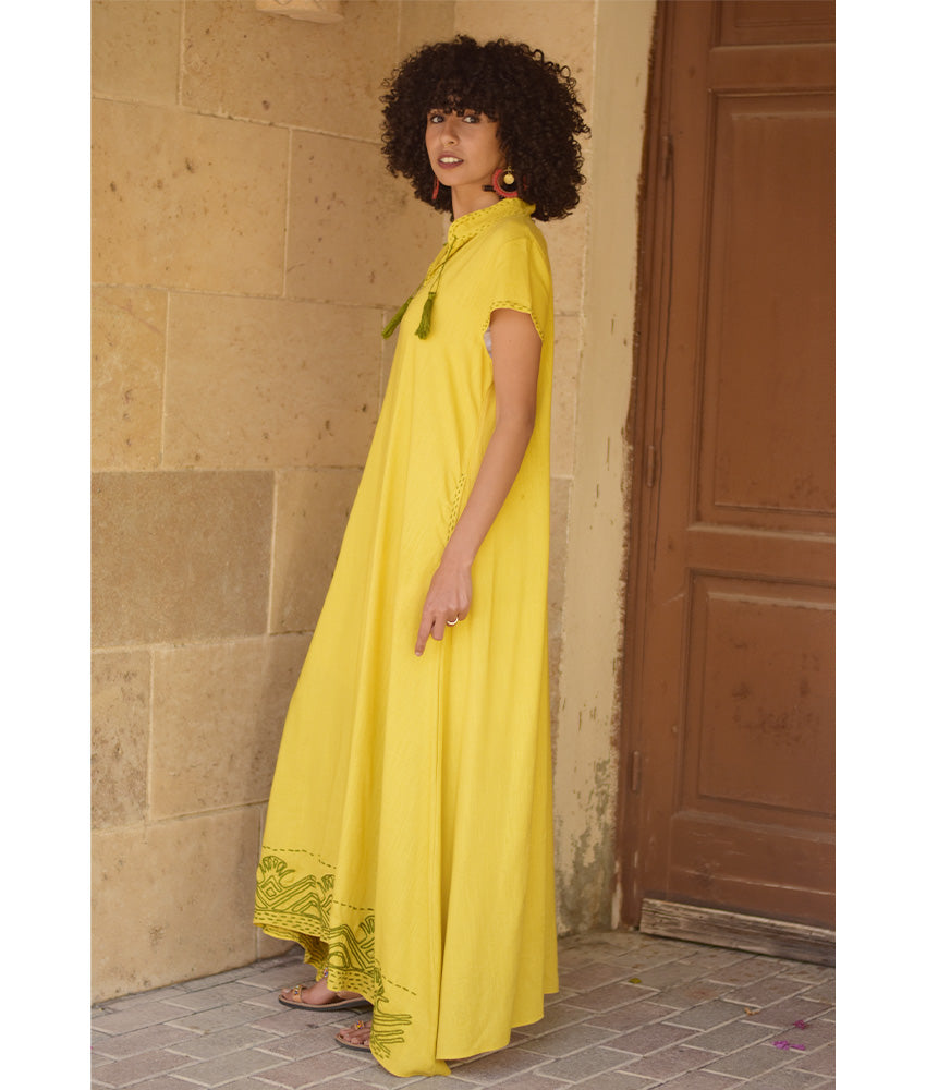 Yellow Linen Dress with Ancient Egyptian Lotus Embroidery handmade in Egypt & available at Jozee Boutique.