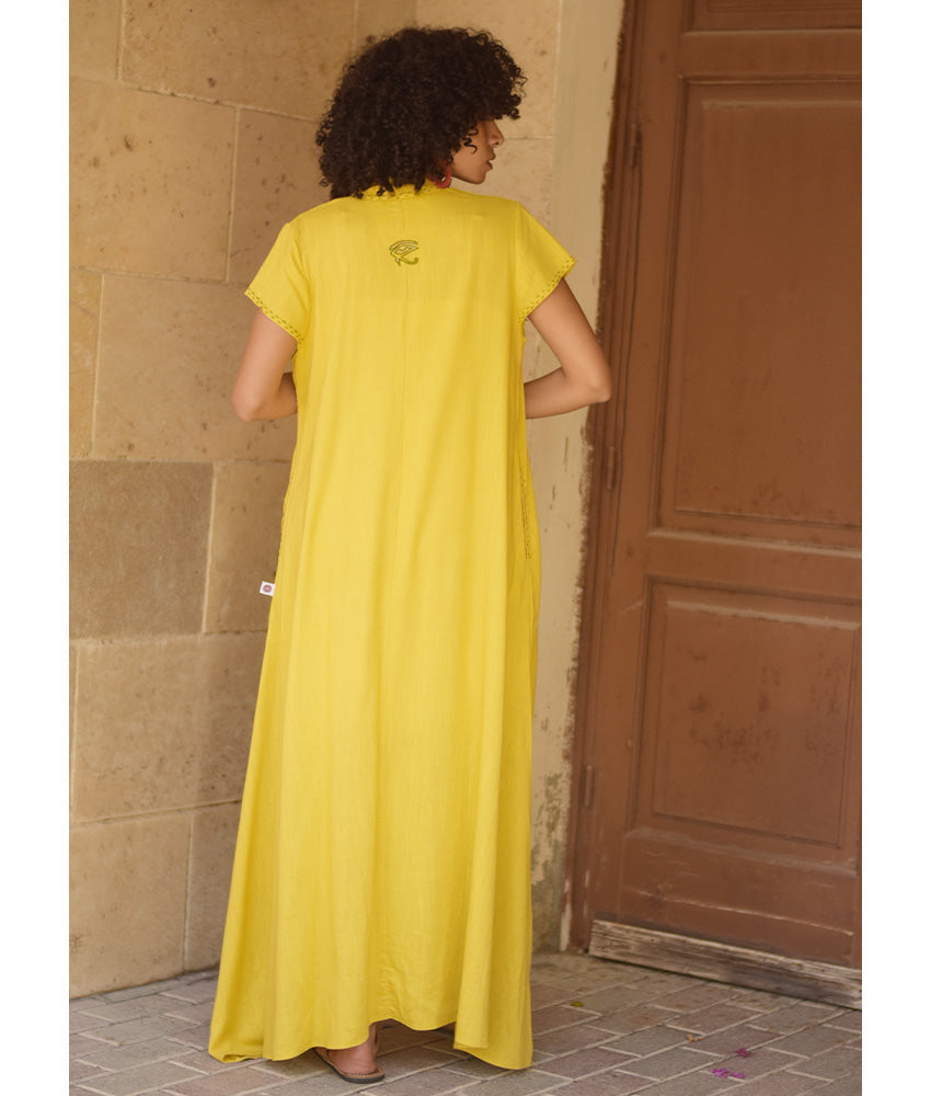 Yellow Linen Dress with Ancient Egyptian Lotus Embroidery handmade in Egypt & available at Jozee Boutique.