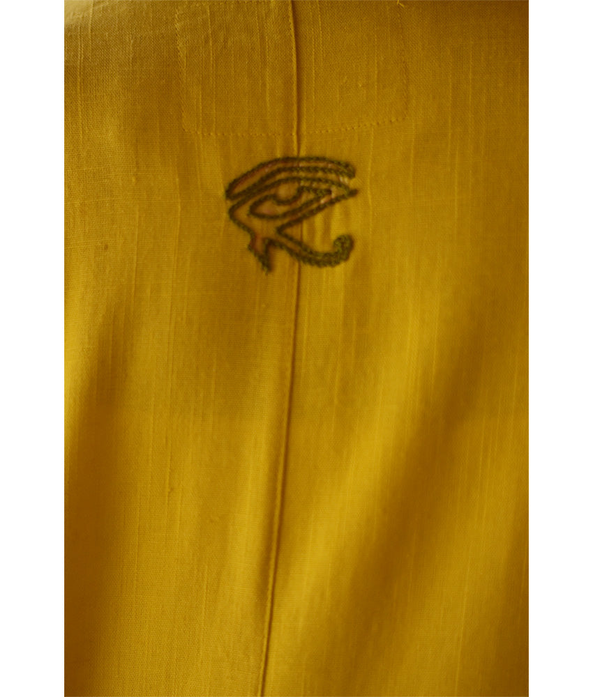 Yellow Linen Dress with Ancient Egyptian Lotus Embroidery handmade in Egypt & available at Jozee Boutique.