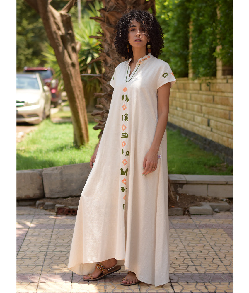 Off White Siwa Embroidered Linen Japanese Dress handmade in Egypt & available at Jozee Boutique.