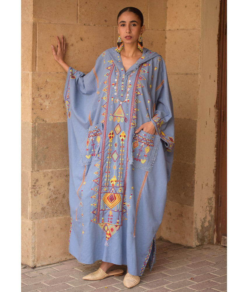 Denim blue Siwa Heavily Embroidered Linen Kaftan with Hoodie handmade in Egypt & available at Jozee Boutique.