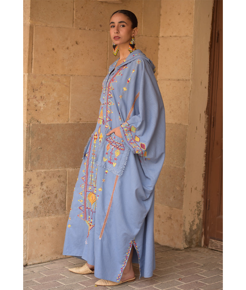 Denim blue Siwa Heavily Embroidered Linen Kaftan with Hoodie handmade in Egypt & available at Jozee Boutique.