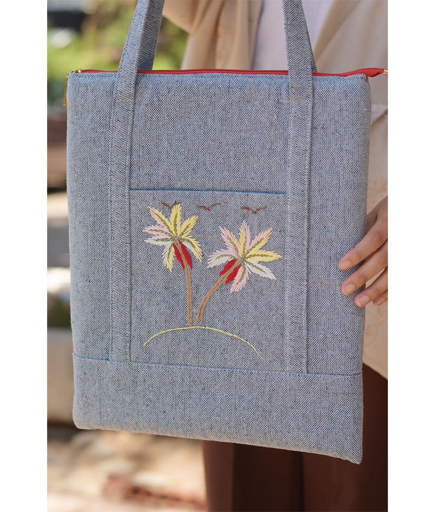 Light grey Embroidered Palm Linen Padded Laptop Bag handmade in Egypt & available at Jozee Boutique.handmade in Egypt & available at Jozee Boutique.