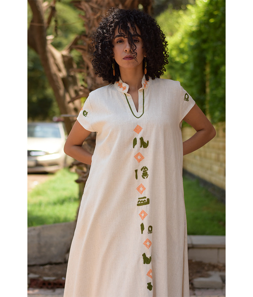 Off White Siwa Embroidered Linen Japanese Dress handmade in Egypt & available at Jozee Boutique.