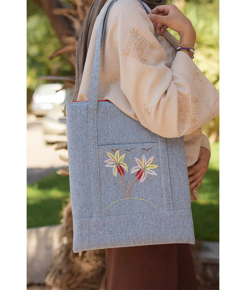 Light grey Embroidered Palm Linen Padded Laptop Bag handmade in Egypt & available at Jozee Boutique.handmade in Egypt & available at Jozee Boutique.