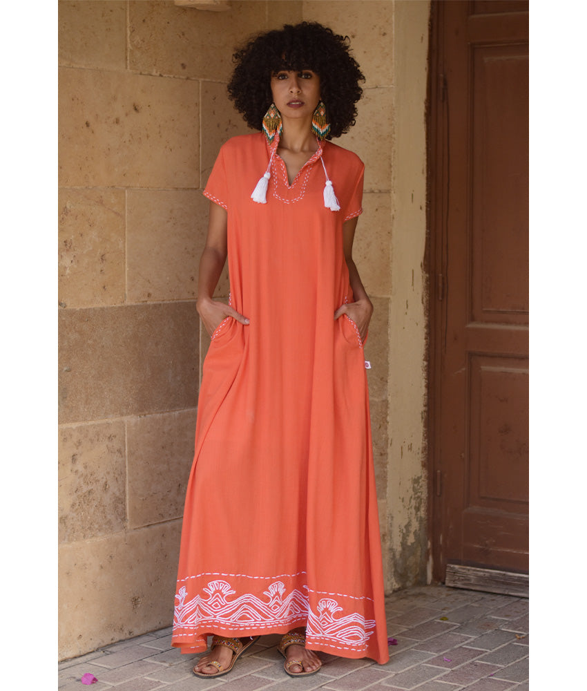 Orange Linen Dress with Ancient Egyptian Lotus Embroidery handmade in Egypt & available at Jozee Boutique.