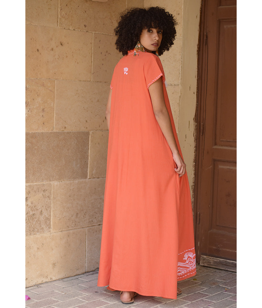 Orange Linen Dress with Ancient Egyptian Lotus Embroidery handmade in Egypt & available at Jozee Boutique.