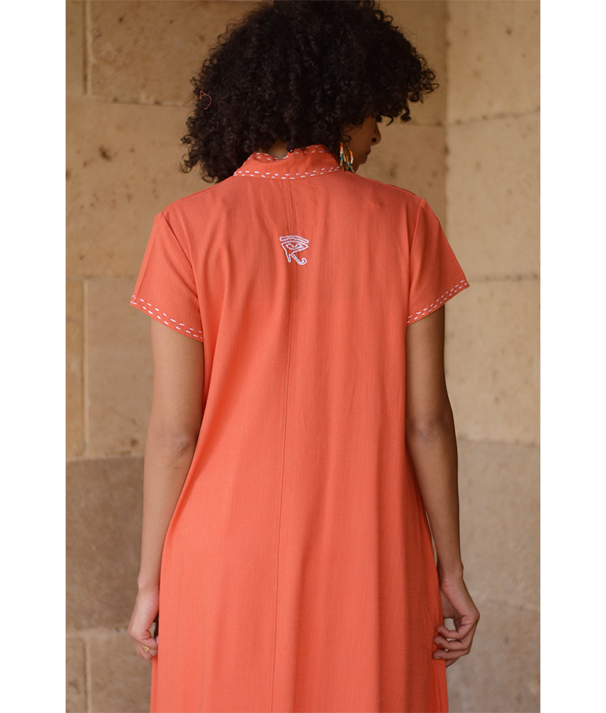 Orange Linen Dress with Ancient Egyptian Lotus Embroidery handmade in Egypt & available at Jozee Boutique.