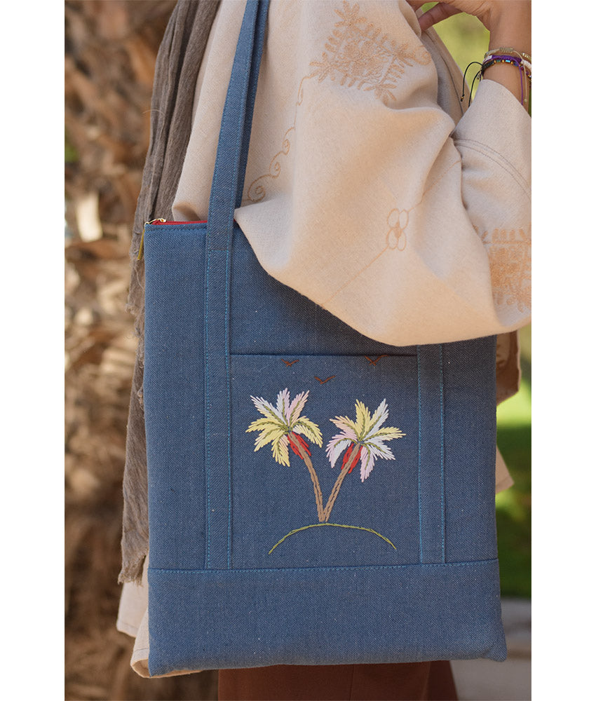Denim blue Embroidered Palm Linen Padded Laptop Bag handmade in Egypt & available at Jozee Boutique.handmade in Egypt & available at Jozee Boutique.
