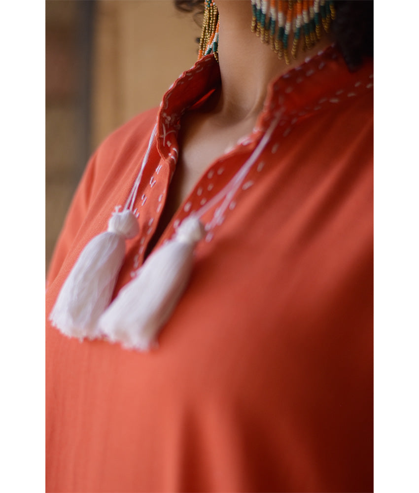 Orange Linen Dress with Ancient Egyptian Lotus Embroidery handmade in Egypt & available at Jozee Boutique.