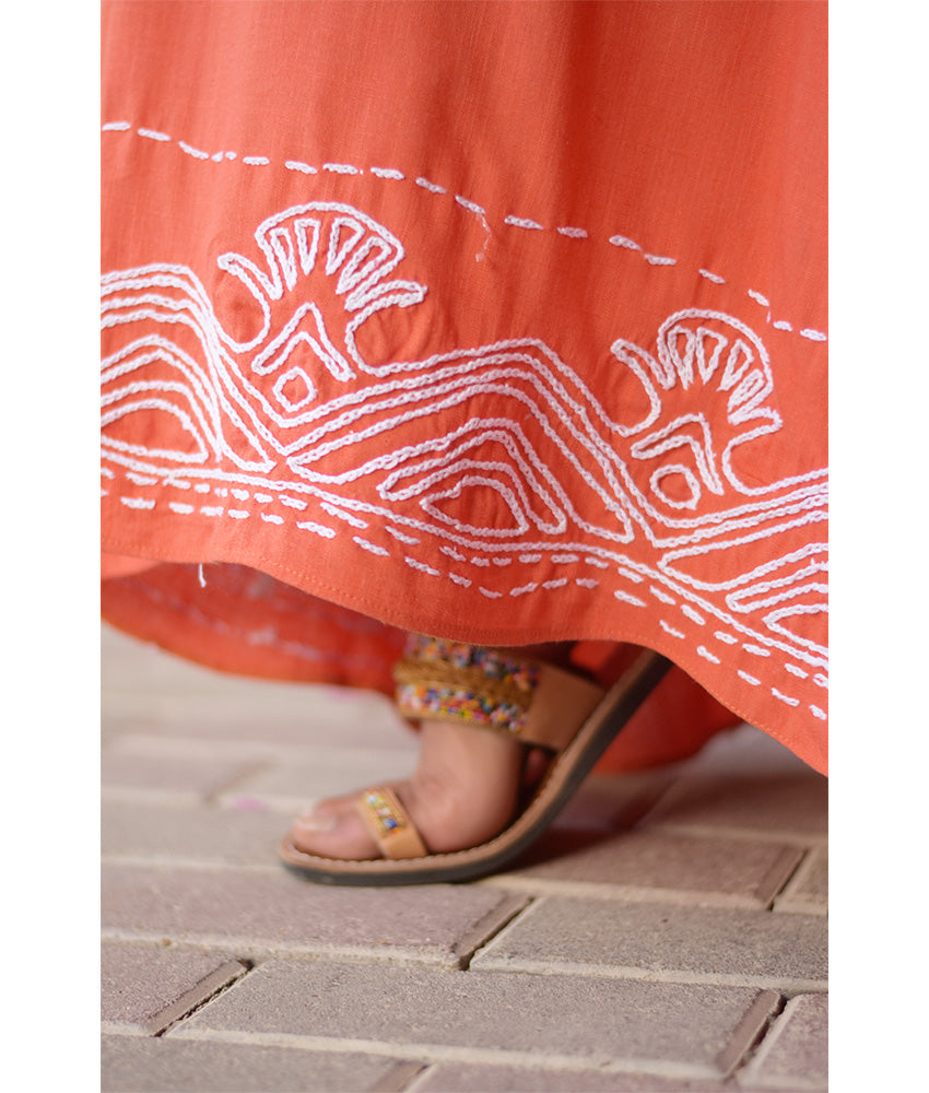 Orange Linen Dress with Ancient Egyptian Lotus Embroidery handmade in Egypt & available at Jozee Boutique.