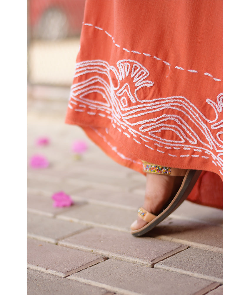 Orange Linen Dress with Ancient Egyptian Lotus Embroidery handmade in Egypt & available at Jozee Boutique.