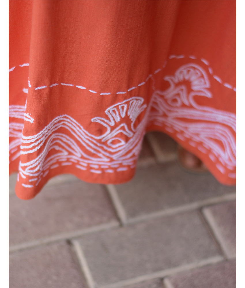 Orange Linen Dress with Ancient Egyptian Lotus Embroidery handmade in Egypt & available at Jozee Boutique.