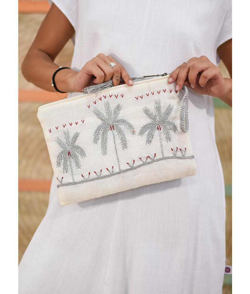 Off White Embroidered Clutch handmade in Egypt & available at Jozee Boutique.