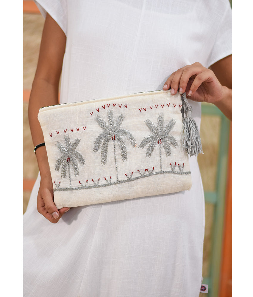 Off White Embroidered Clutch handmade in Egypt & available at Jozee Boutique.